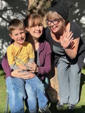 Green Trees Director Susie Lyddon (right) with infant lead teacher Jess Shadler and a Green Trees student.