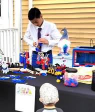 Sam Fisher, 13, at his booth selling 3D keychains last year.