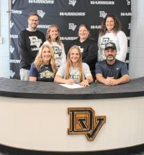 L-R Front: Jacqueline Kraszewski, senior Ava Kraszewski, and Kurt Kraszewski. L-R Back: Assistant lacrosse coaches Andy Rupp and Krystine Thompson, head lacrosse coach Bernadine Salak, and assistant lacrosse coach Lindsay Duffy.