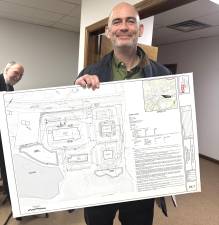 Engineer Patrick McClain shows the proposed site plan for the Santos Farm site.