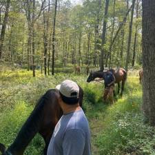 The program includes horsemanship activities and a shared community meal.