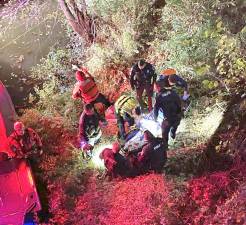 Emergency responders helped secure the woman and transport her to safety.