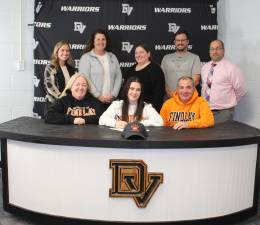 L-R Front: Katy McCormack, Carrigan McCormack, and Matt McCormack. L-R Back: Assistant coaches Krystine Thompson and Lindsay Duffy, head lacrosse coach Bernadine Salak, assistant coach Andy Rupp, and Delaware Valley High School Principal Lou DeLauro.