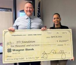 Delaware Valley School District Assistant Superintendent and Delaware Valley Educational Foundation President Jayson Pope with Wayne Bank Milford Community Office Manager Madeline Portugal.
