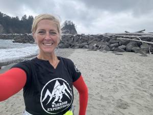 Milford’s Suzanne Williamson is all smiles as she reaches the Pacific Ocean.