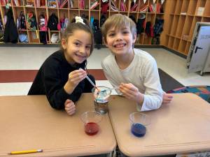 Daphney Hernandez and Felix Ryan learn about precipitation.