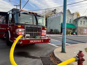 Fire crews help knock down a wall fire at Rosie’s on Pike Street.