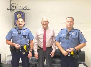 Pike County Sheriff Kerry Welsh (center) presents sheriff deputies Kevin Westling and Michael Church each with the Award of Merit.