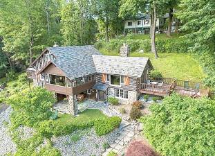 This home is nestled high above stunning Lake Mohawk