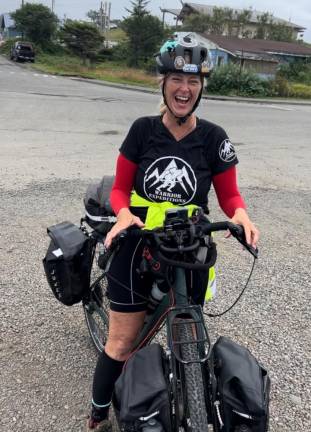 Milford’s Suzanne Williamson is all smiles as she reaches the Pacific Ocean.