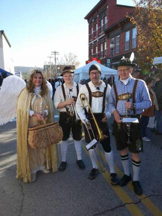 The wandering Oompah Band with a Christmas Angel.