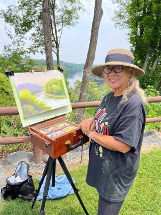 Artist Pearl Lau and her work in progress.