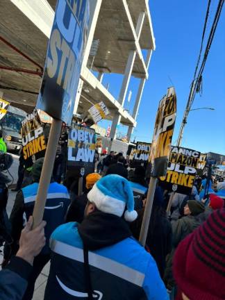 Niklas Moran, who is trying to unionize the Montgomery Amazon warehouse, marched in soliday with striking workers in Queens on Dec. 19.