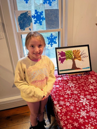 Green Trees student Danielle Owen proudly showing her “Four Season Tree” artwork.