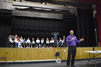 Delaware Valley Superintendent Brian Blaum, who moderated the bee, tells the audience of parents and students, “They’re just here to have fun. It’s show-off time.”