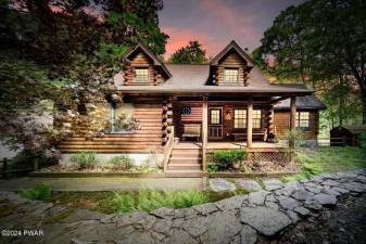 Lakefront log cabin in a private setting is a slice of paradise