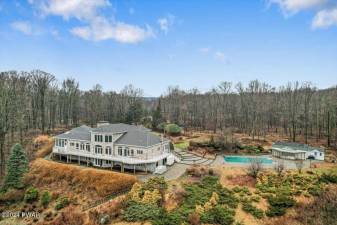 Five-bedroom estate on 56+ acres features gardens, a pool, and more