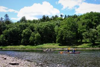 Kayakers enjoying a quiet paddle on the Upper Delaware Scenic and Recreational River.