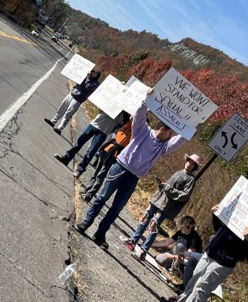 Students protest outside the school on Monday afternoon.