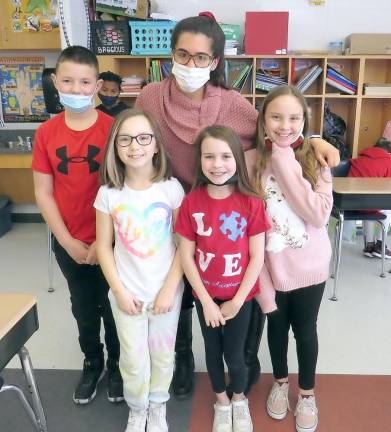 Ms. Samantha’s fourth-grade class stop for a picture during their end-of-day party, from left: Blake Mady, Aubry Johnson, Ms. Paz, Adalie Lewis, Ayla Martine (Photo by Ped Snure)