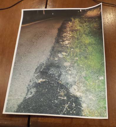 Patrick Mullins showed this photo to task force members of a disintegrating Sawkill Road. (Photo by Frances Ruth Harris)
