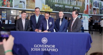 Gov. Josh Shapiro signs the executive order.