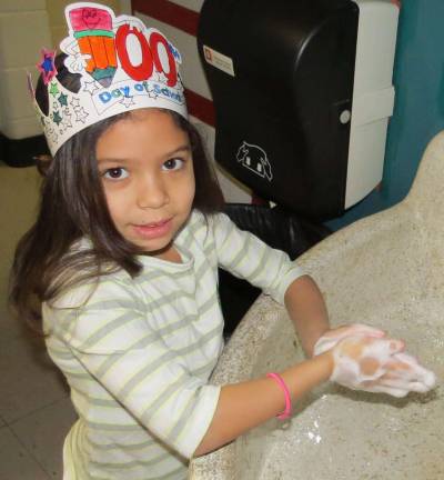 Vicely Cepeda, a second grader in Carol Navitsky' class (taking a break to wash her hands).
