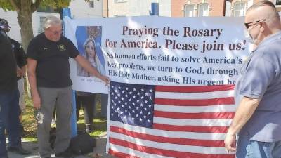 Catholics gather to pray the Rosary