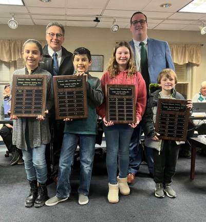 This year’s spelling bee winners alongside Rotary members.