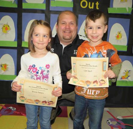 Pre-K PM Students of the Month: Grace Panaro and Liam Quill with DVES Principal Aaron Weston.