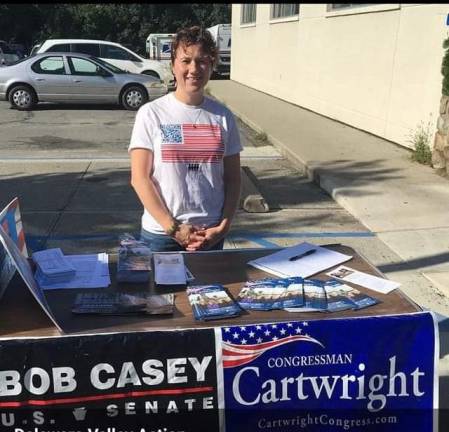 A group supporting Democrat candidates stationed outside the Milford Post Office, at nearly the same location as other groups.