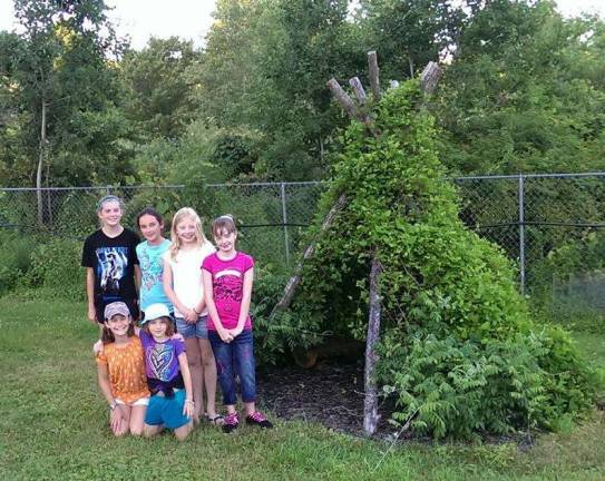 The Rad Razberries 4-H Club gardens in a surprising way. This clever teepee has a covering formed by climbers that gradually grow up the structure. Now the children have a shady hideaway, with exceptional insulation and air quality -- but watch out for bugs! (Photo provided)
