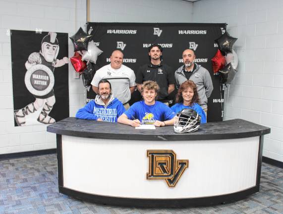 L-R Front: Brian Mackey, Bryson Mackey and Denise Mackey. L-R Back: Head lacrosse coach Jeff Krasulski, assistant coach Anton Mackey, and assistant coach Daniel Gonzalez.