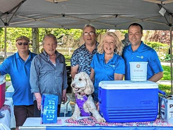 Rotary members Dean Quirk, Allan Schatz, Grace the pet, Ed Loeschorn, Karen Loeschorn, and Shaun Burger.