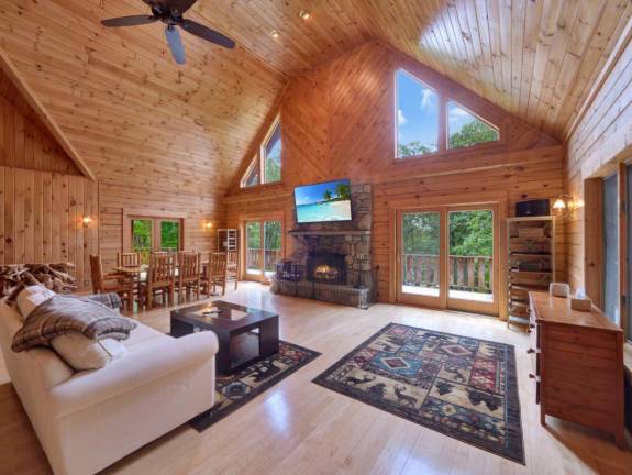 Upscale craftsman-style log home has a lake view and room for all