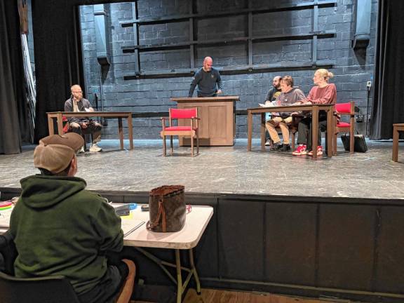 Actors in the upcoming production of “A Few Good Men” rehearse a scene.