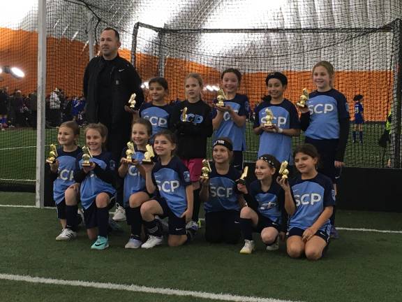 Back row (left to right): Coach Christopher Lagarde, Ella Ferara,<b> </b>Harper Lagarde, Afton Pope, Victoria Garcia, and Braelyn Graziano. Front: Peyton Gould, Piper Space, Juliana Medeiros, Juno Gara, Sophia Targosz, Brooklyn Mann, and Ava Ferara.