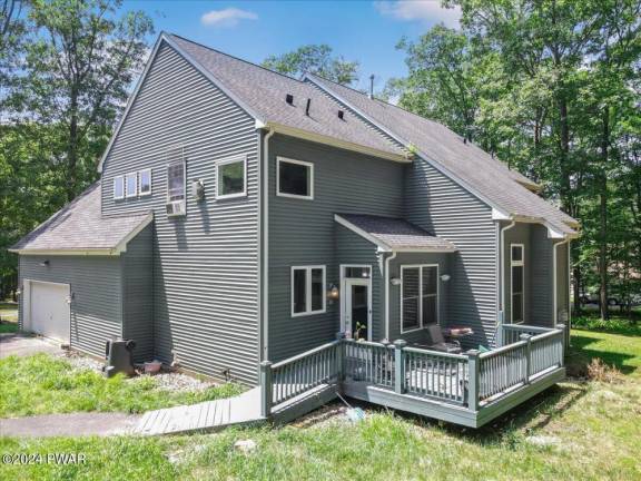 Enjoy country quiet on 1+ acres in this four-bedroom colonial