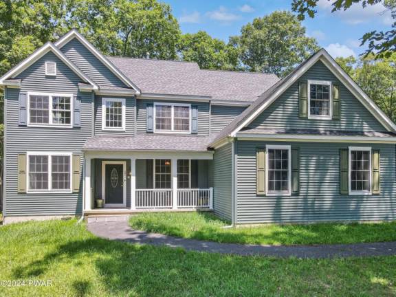 Enjoy country quiet on 1+ acres in this four-bedroom colonial