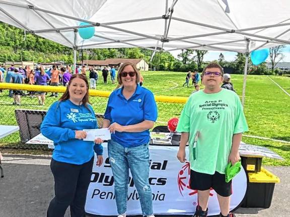 L-R: Executive Director Special Olympics NE Heather Schreiner, rotary secretary Mary Olsen, and athlete Kendall Barone.