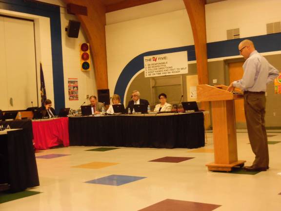 Don Flynn of Burkavage Design Associates presents the gym contract to the board. (Photo by Anya Tikka)