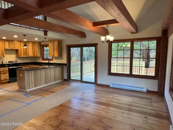 Renovated country home features acreage and low taxes