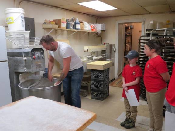 Owner Scott Oliver gets the mixer ready to make the bagels.