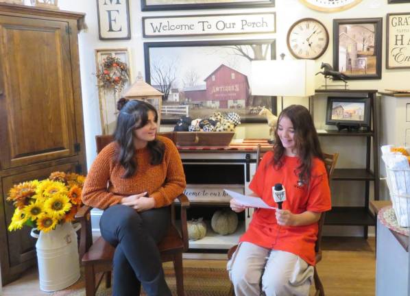 <i>Julia Roome, left, answers questions from DVE-News/TV reporter Madisyn Colon. </i>