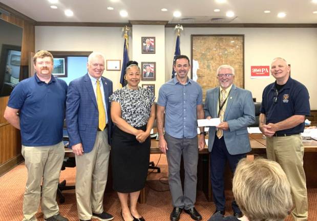 L-R: Pike County Training Center Director of Operations Kyle Rohner, Pike County commissioners Ronald Schmalzle and Christa Caceres, Kinder Morgan Vice President of Public Affairs Allen Fore, Pike County Commissioner Matthew Osterberg, and Pike County Director of Public Safety Tim Knapp.