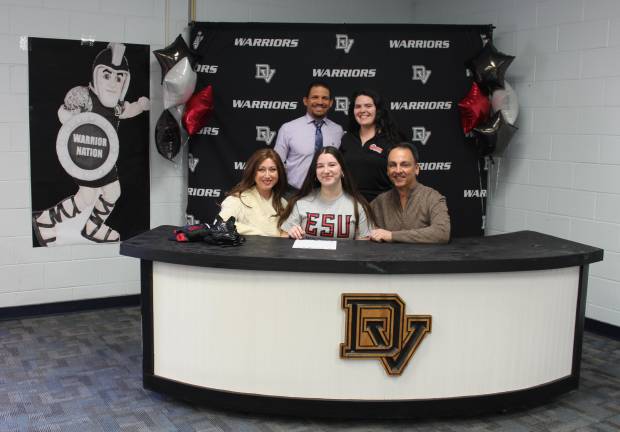 L-R Front: Tricia Langelotti, Kristen Langelotti, and Richard Langelotti. L-R Back: Head wrestling coach Evan Bates and assistant wrestling coach Karley May.