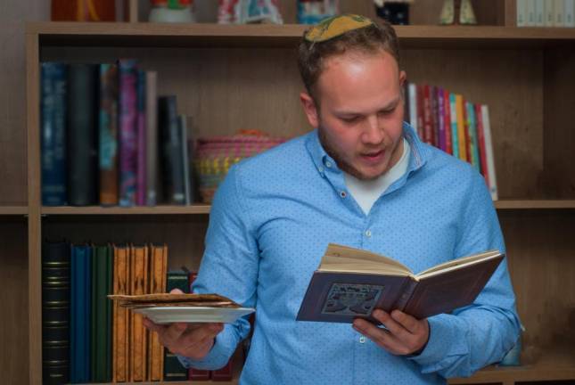 A Jewish man reads from the Haggadah during Seder, a feast celebrated on the first night of Passover, a holiday commemorating the Jews' exodus from Egypt. Passover 2020 begins the evening of Wednesday, April 8, and ends in the evening of Thursday, April 16.