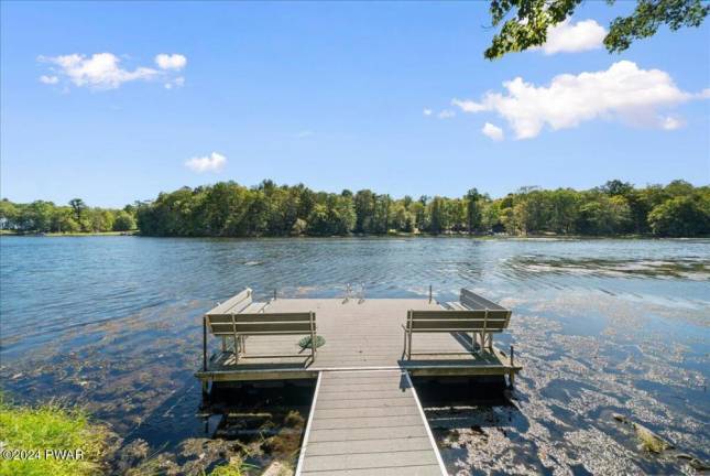 Updated home offers a lakefront sanctuary with private dock