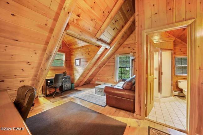 Lakefront log cabin in a private setting is a slice of paradise