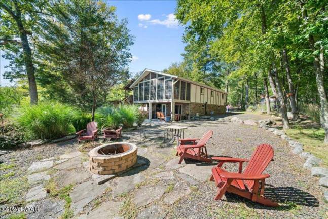 Updated home offers a lakefront sanctuary with private dock